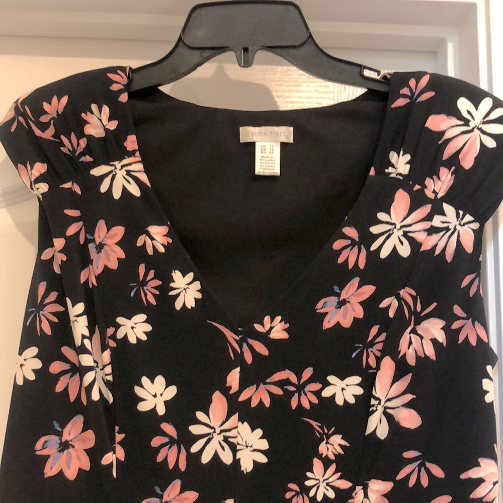 Black dress, pink, and cream flowers